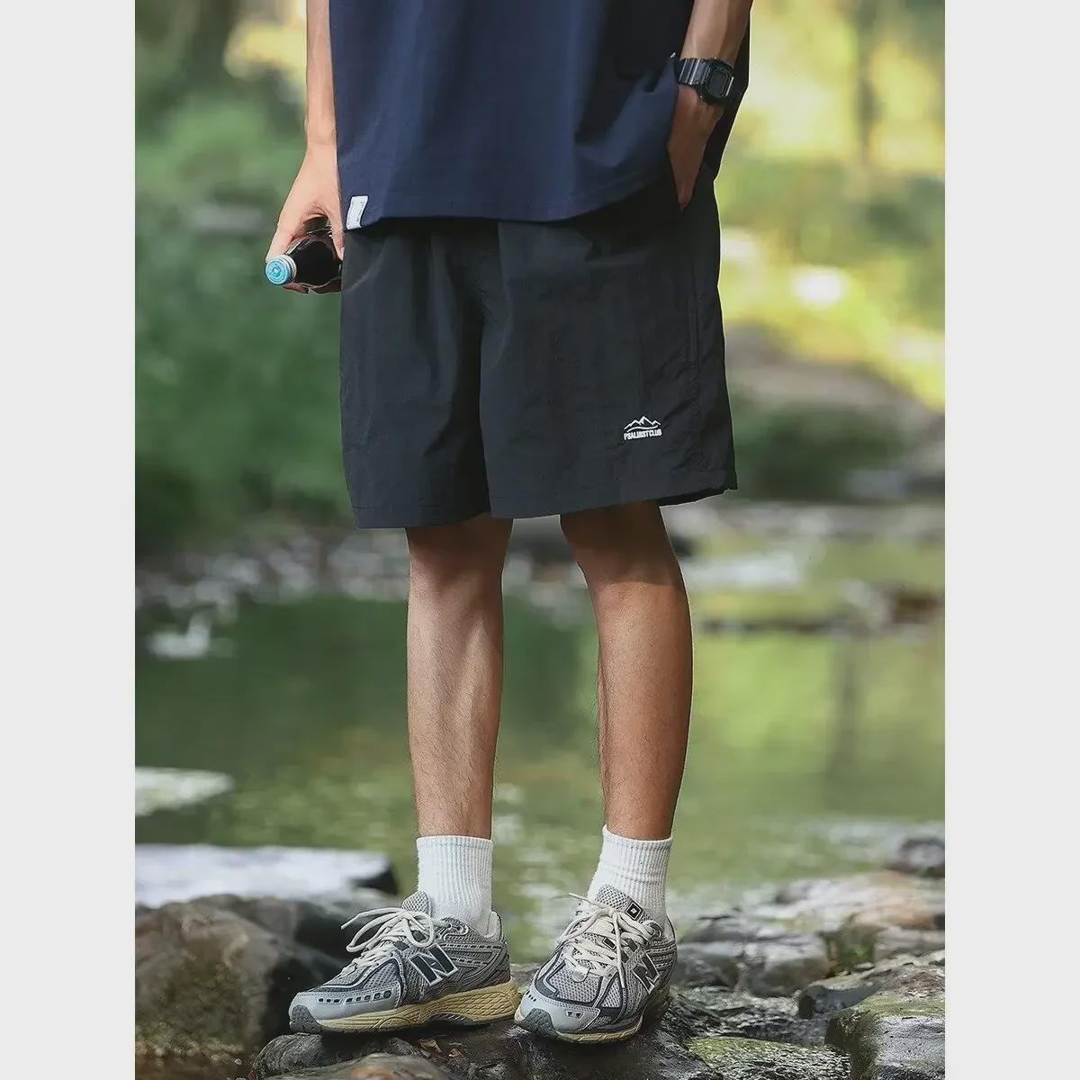 

Унисекс быстросохнущие однотонные летние спортивные шорты в японском стиле для активного отдыха - универсальные и модные 2XL чёрный