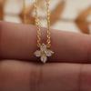 Gold-Plated Titanium Steel Flower Necklace with Inlaid Diamond and Clover Pendant - Non-Fading Luxury Clavicle Chain