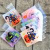 100pcs Halloween Gift Bags. Self-adhesive with pumpkin, ghost & bat designs for party treats.