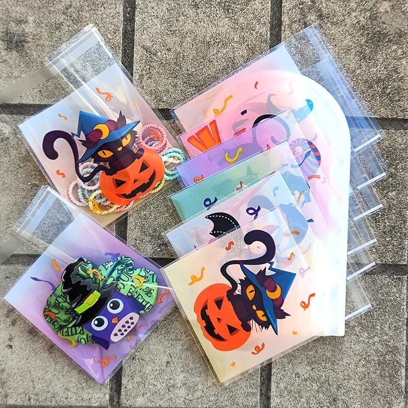 100pcs Halloween Gift Bags. Self-adhesive with pumpkin, ghost & bat designs for party treats.