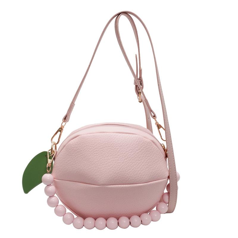 

Small fresh literary women s bag 2025 new Mori sweet fashion contrasting colors niche beaded hand carry crossbody small round bag рожевий