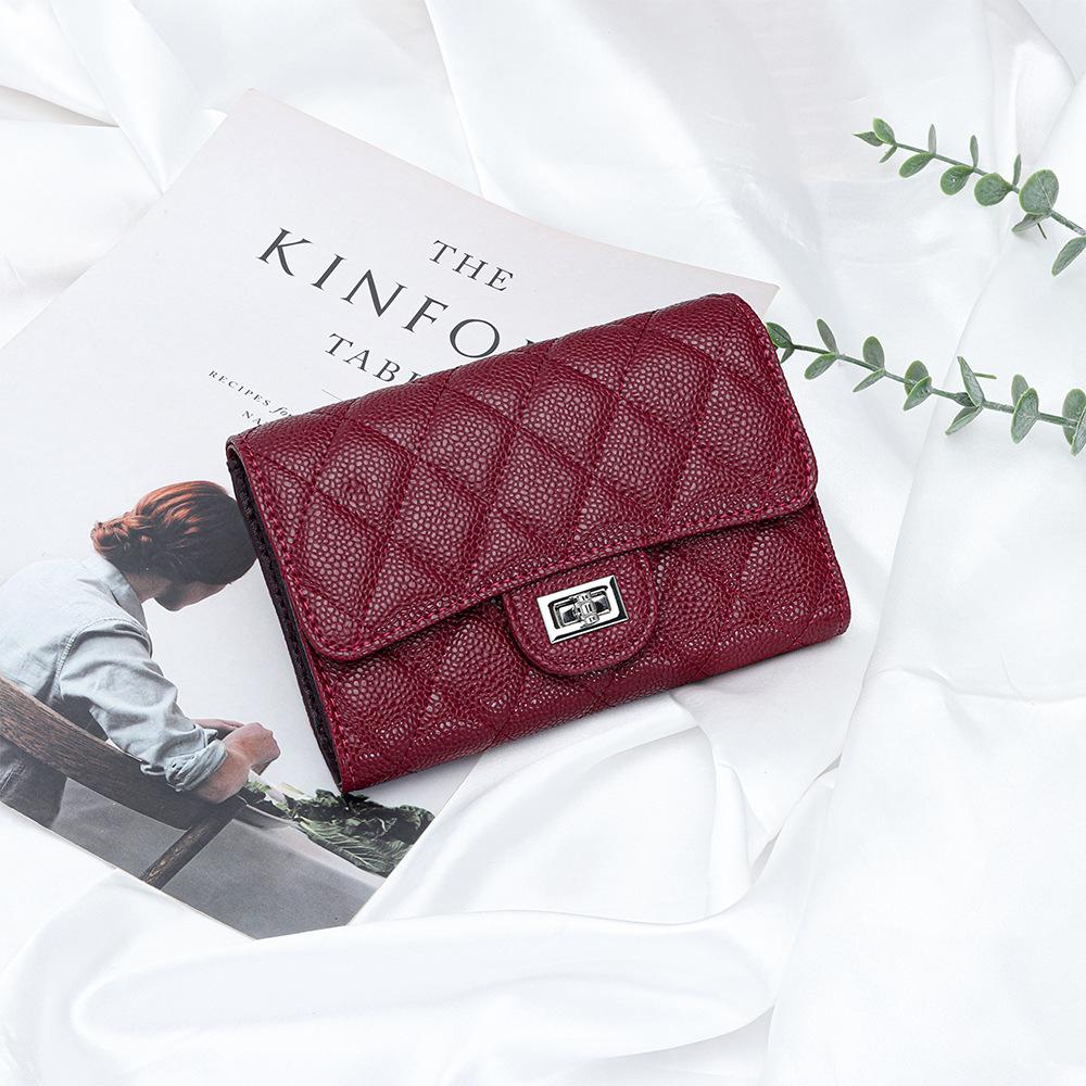 Cartera corta de cuero de lujo ligero para mujer, nueva de 2025, plegable de tres pliegues, billetera corta de piel de vaca caviar, espacio para múltiples tarjetas