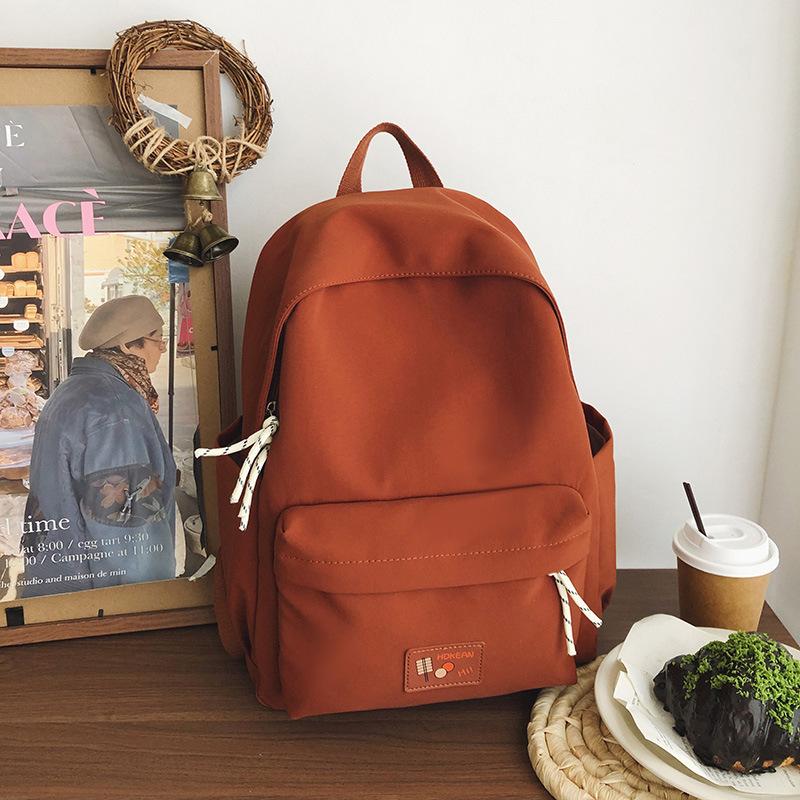 New casual simple solid color backpack large capacity junior high school student schoolbag