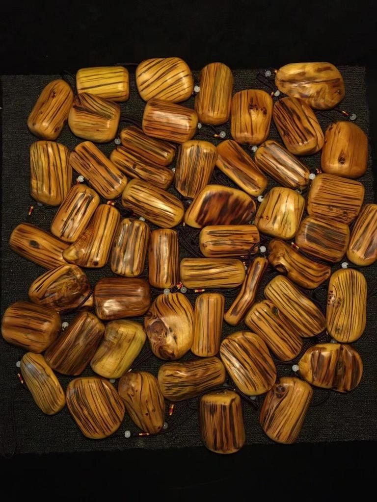 Tiger Stripe Cypress Wood Carved Pendant
