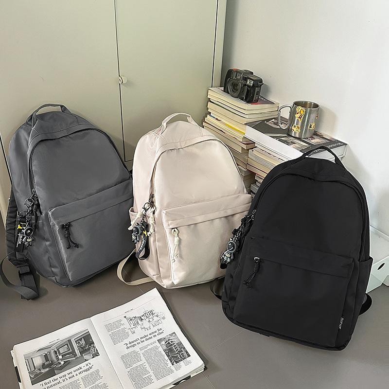New trendy and cool men's casual backpack, junior high school student class schoolbag, women's large-capacity simple backpack