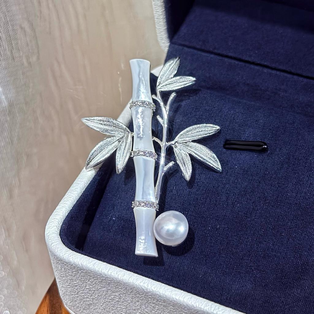 Chinese-style brushed bamboo flower brooch with natural freshwater pearls, a traditional Chinese accessory for cheongsam