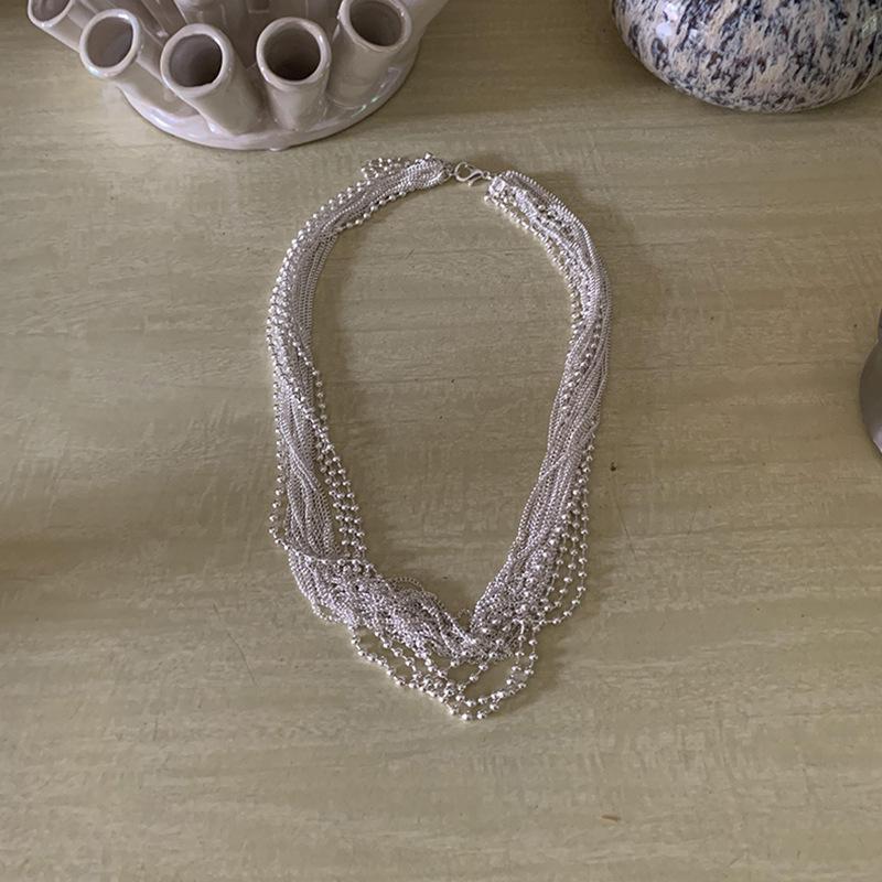 

Преувеличенная многослойная текстура металлического ожерелья Женский нишевый дизайн Чувство уникальной индивидуальности Модная цепочка на шею Цепочка на ключицу