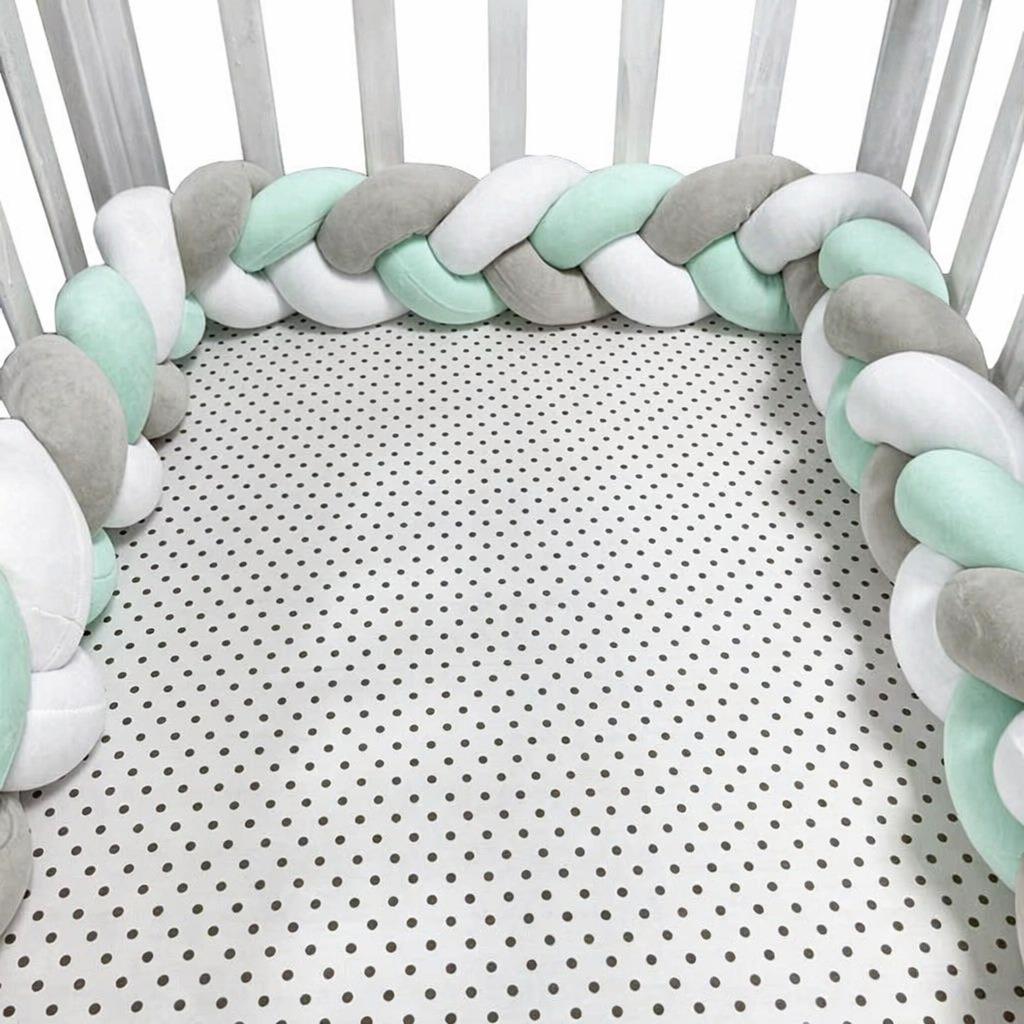 Three-strand knitted crib bumper, cable knit crib bumper