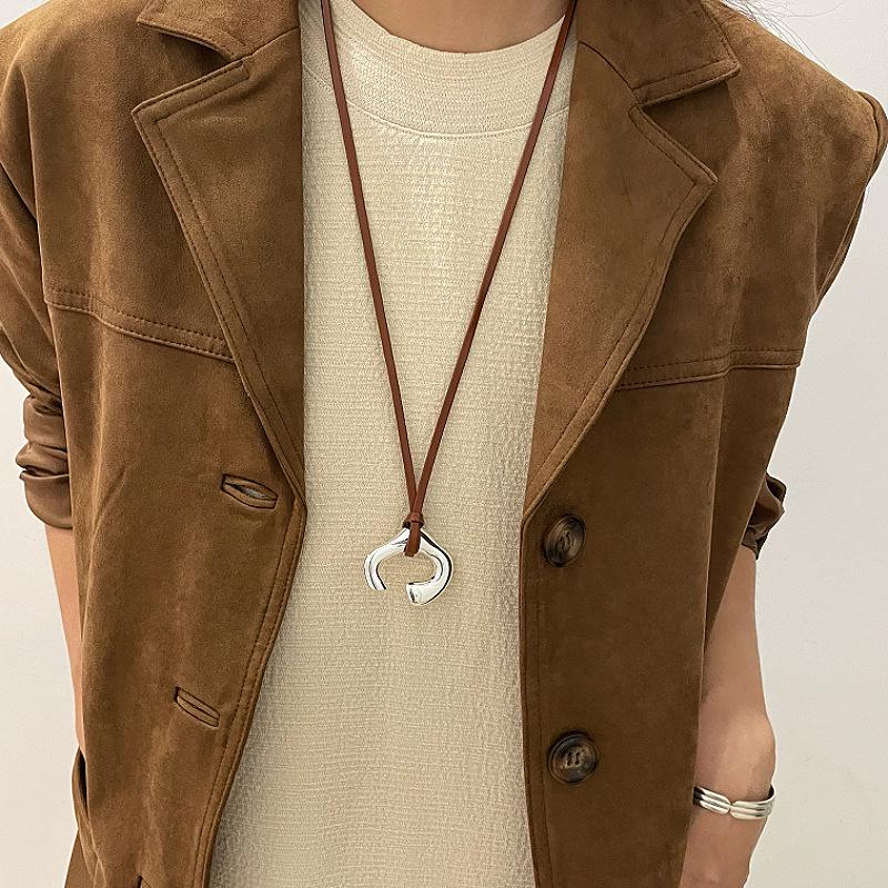 New Korean Brown Leather Cord Necklace with Abstract Human Body Silver Pendant - Light Luxury Clavicle Chain