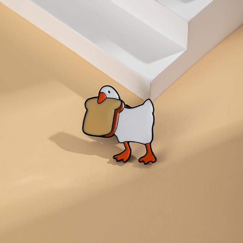 Urocza Broszka Kaczuszka z Kreskówki – Kreatywne Metalowe Akcesoria do Odznak