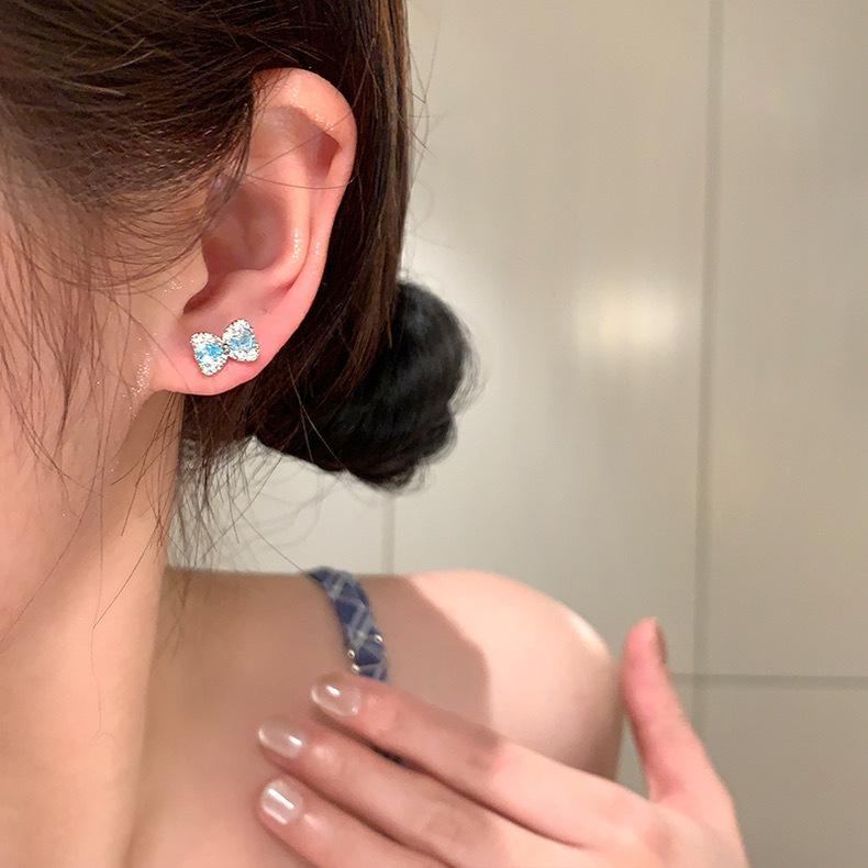 

Korean flash zirconium bow titanium steel ear hole earbone nails sleep free temperament exquisite earrings women s stud earrings