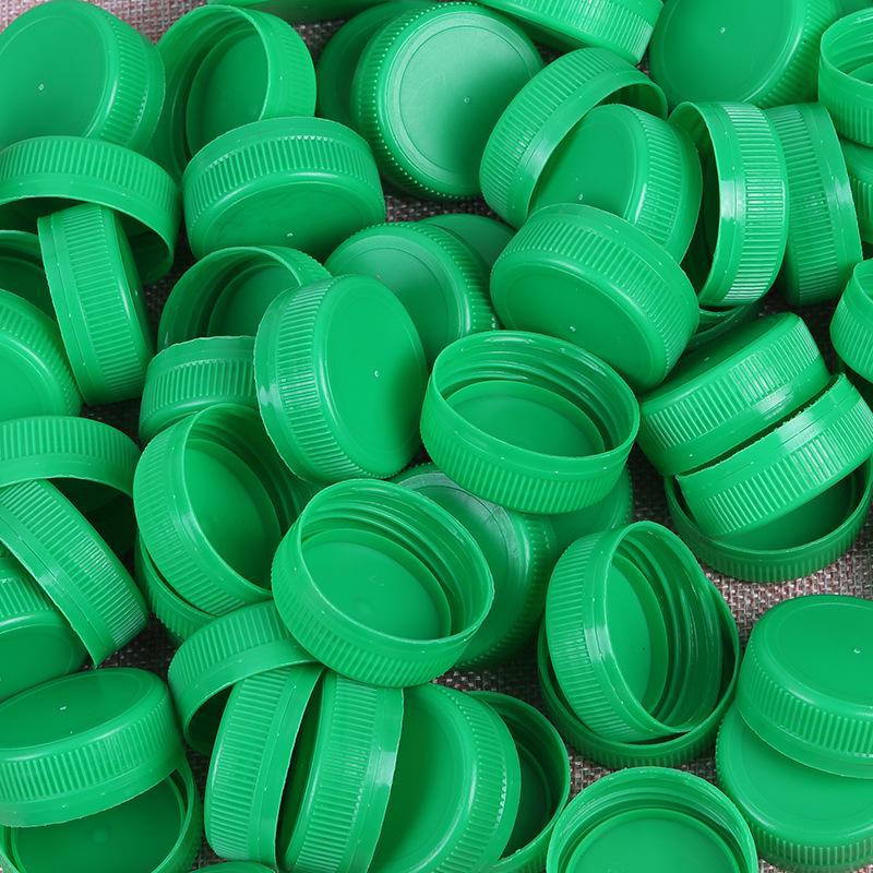 

Різнокольорові пластикові кришки для пляшок для DIY проєктів та креативних ремесел