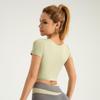 Juyitang Women's Yoga Set: Nude Navel-Baring Short Sleeve with Chest Pads, Color-Matched Fitness Wear.