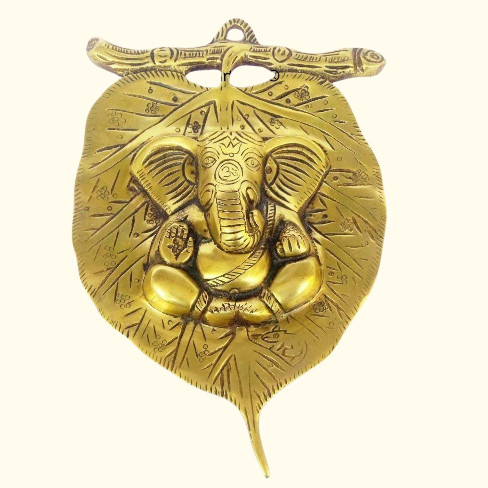 

Lord Ganesha Leaf Wall Hanging With Left Side Trunk Near Modak Idol, Brass