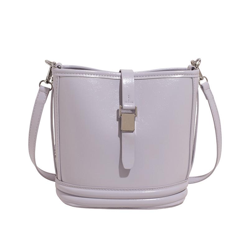 Korean new product, sweet and light color, gentle wind temperament bucket bag, women's commuting versatile and advanced messenger bag