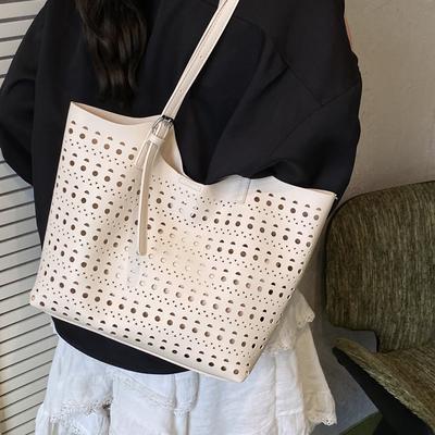 Großes Fassungsvermögen geschnitzte Hohl-Tragetasche Damen-Tasche 2025 neue Mode Textur Umhängetasche Damen Pendler Achseltasche