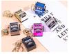 Gold-Plated Creative Tiger Fruit Machine Keychain Toy with Lottery Play Feature