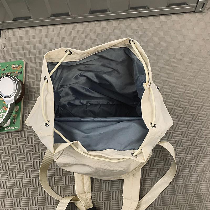 2025 spring new solid color college student backpack women's outdoor leisure large capacity simple high value backpack men