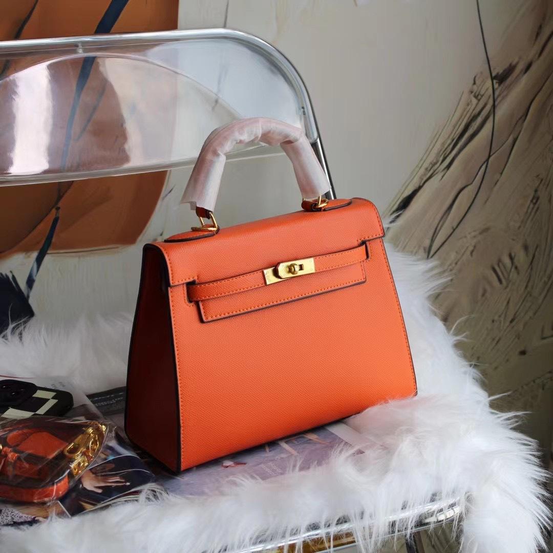 

Second-generation women s bag genuine leather portable cowhide bag shoulder bag commuter shoulder crossbody large capacity light luxury 22cm помаранчевий