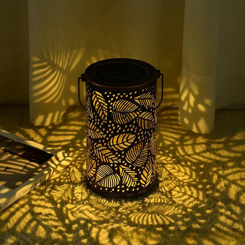 2026 New Solar Waterproof Iron Hollow Lantern Outdoor Hanging Ambient Light for Lawn Garden Villa Patio Yard Decoration