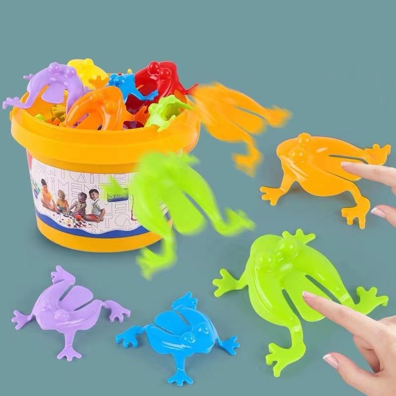 12 Stück Hüpfender Frosch Fidget Spielzeug Fingerdruck Lustiger Hüpfender Frosch mit Eimer Stressabbau Spielzeug Für Kinder Geburtstagsgeschenk