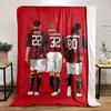 Three soccer players in red and black striped jerseys with white shorts. for all seasons blanket lunch break throw gift