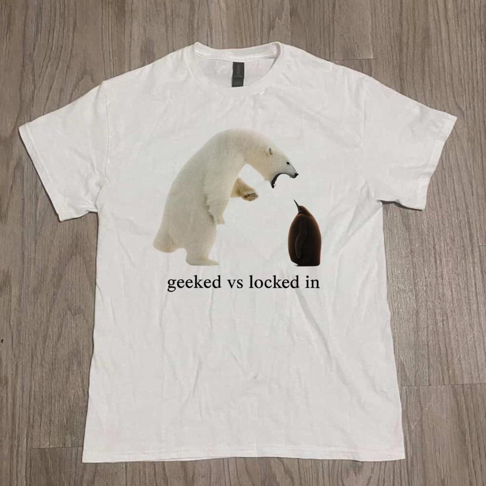 geeked vs locked in shirt, viral animal meme tee, funny streetwear graphic t-shirt, trending humor gift, POV meme shirt M