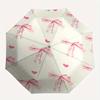 Ombrello pieghevole automatico con fiocchi rosa, design semplice a otto stecche, motivo a colori vivaci, telaio in ferro resistente, ideale per viaggi e attività all'aperto, spiaggia