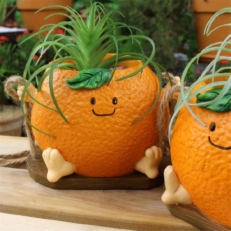 Creative Multifunctional Orange Swing Planter Pot With Swing Feature Suitable for Kids Entertainment and Home Gardening
