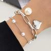 Korean Retro Peach Heart Pearl Bracelet: Women's Multi-layer Pendant Chain, Simple & Elegant Design.