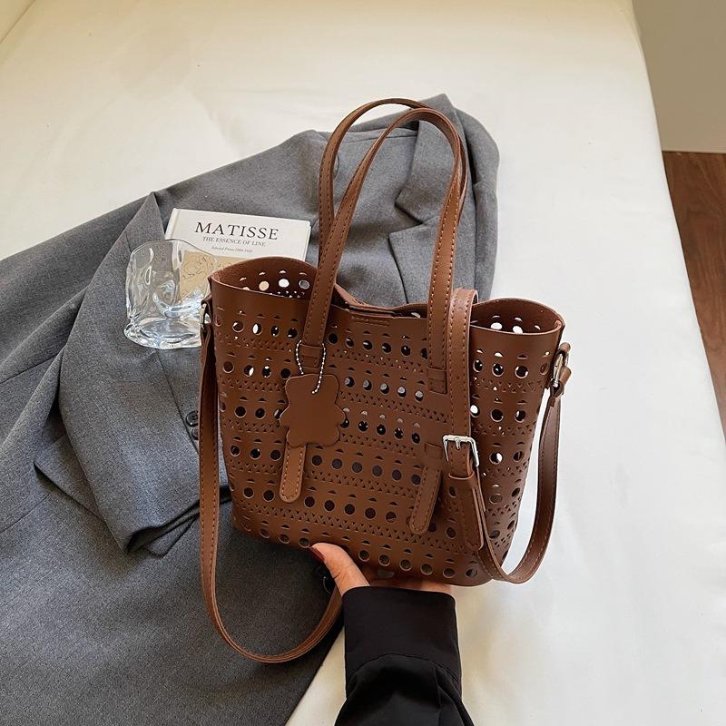 Nischendesign hohler Gemüsekorb Damentasche neue Mode Bucket Bag große Kapazität Schulter Umhängetasche