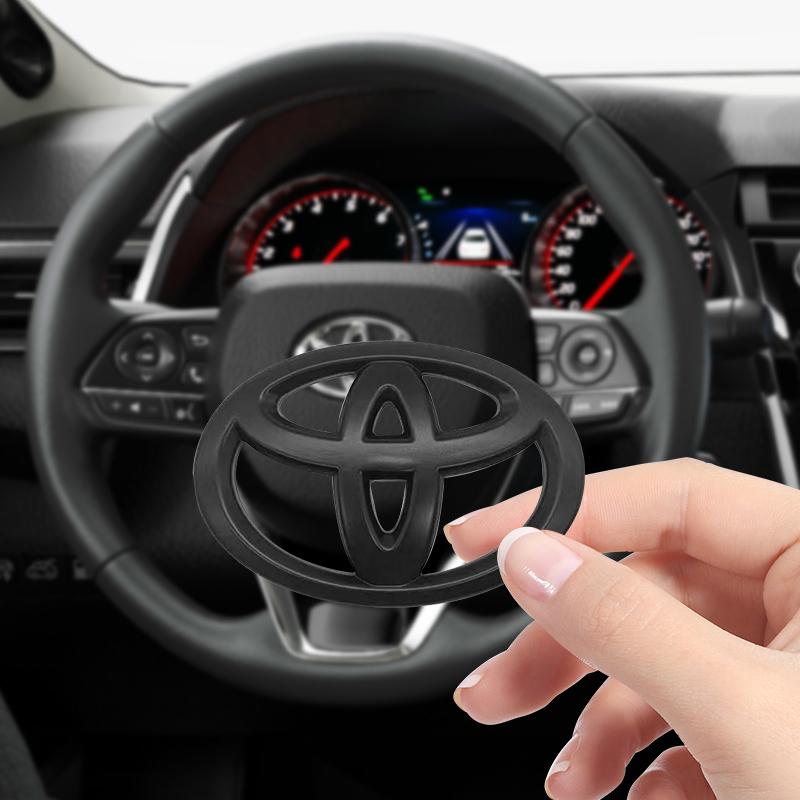 65X47MM Car Steering Wheel Center Emblem Logo Sticker For Toyota Corolla Yaris Aygo Prius RAV4 Crown CHR Camry Auris Verso