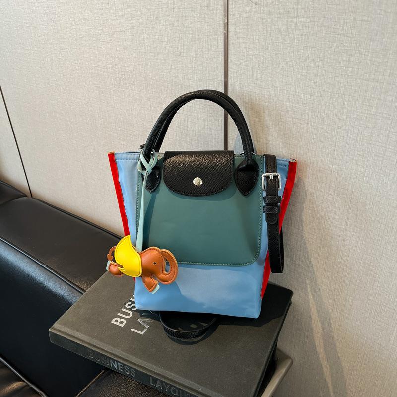 

Small tote bag new pu fashion trend shoulder tote bag color matching handbag messenger bucket bag синій