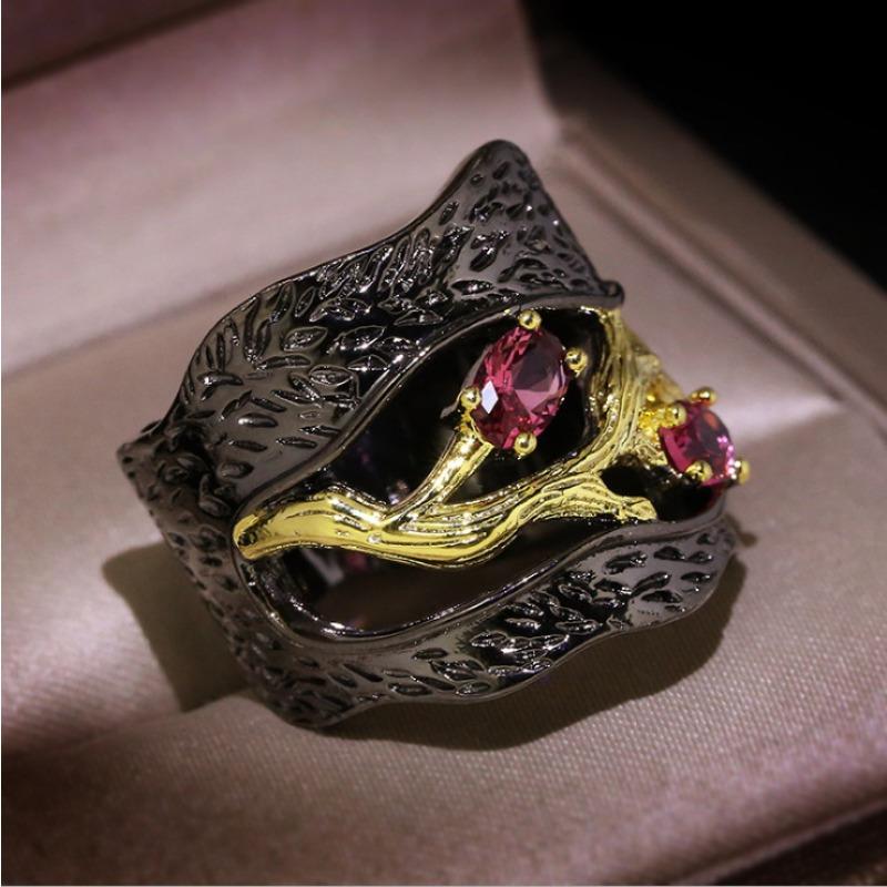 Black and gold branch ring with inlaid accents. Unique art style for Halloween and Christmas—mysterious and fantastical.