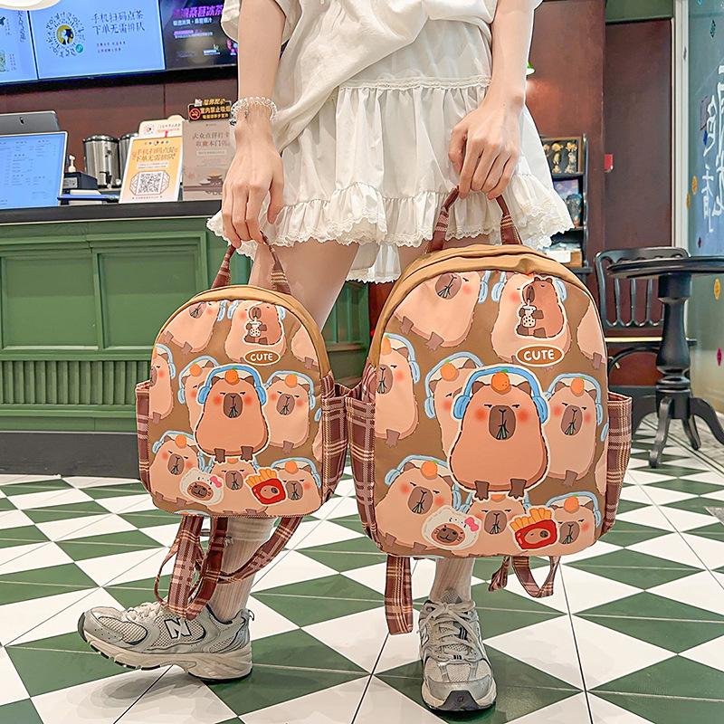 

New Kapibara children s bag, cute cartoon school bag for men and women, outdoor leisure spring outing backpack Small небо синє кольору