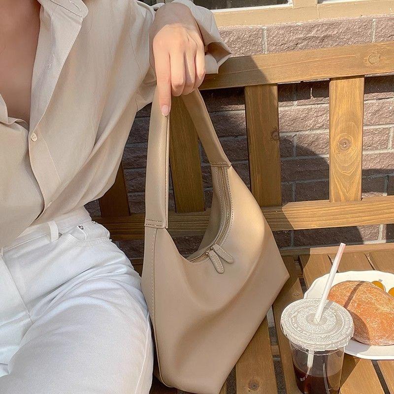 ins simple and versatile milk tea color bag gentle wind Korean portable soft leather dumpling bag retro shoulder armpit bag