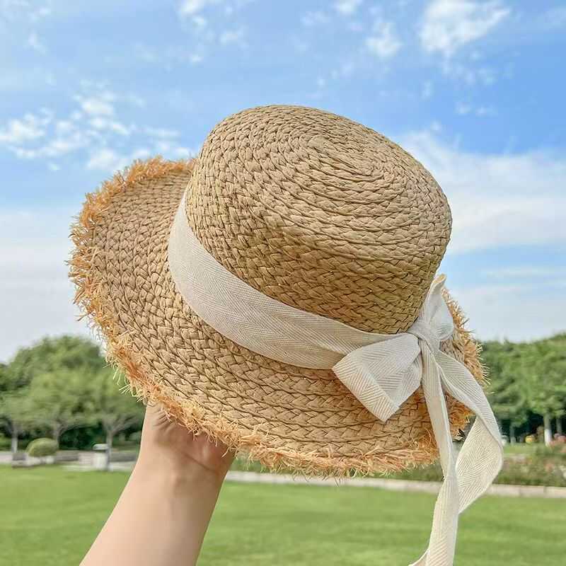 Versatile burr straw hat women's summer flat top travel sun hat small fresh bow sunshade beach hat