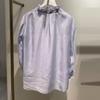 In Stock: 2026 Spring Fashion Sky Blue Lace-up Ruffle V-neck Women's Shirt 1H3120101G