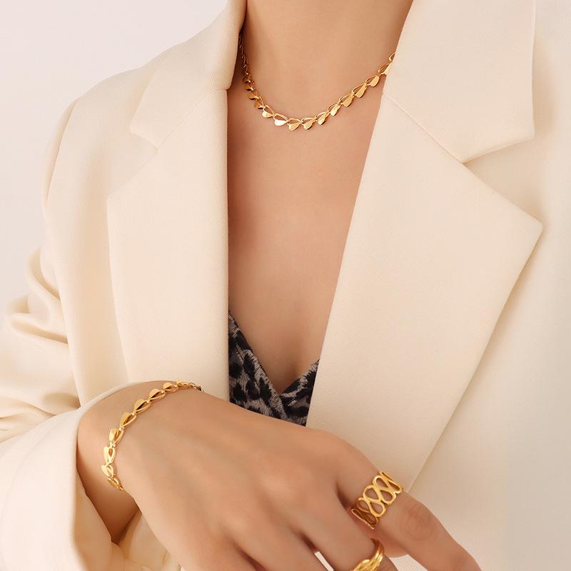 European & American Fashion Slim Waist Hollow Heart Necklace & Bracelet Set
