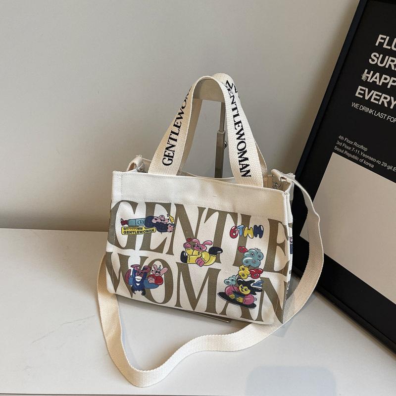 Fashion letter canvas small bag women 2025 new casual fashion messenger mobile phone bag going out tote bag simple