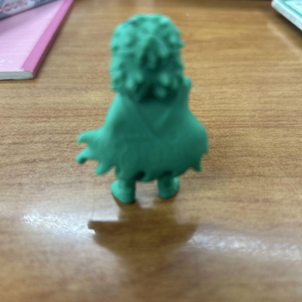 [USED] A small figurine with a green sword