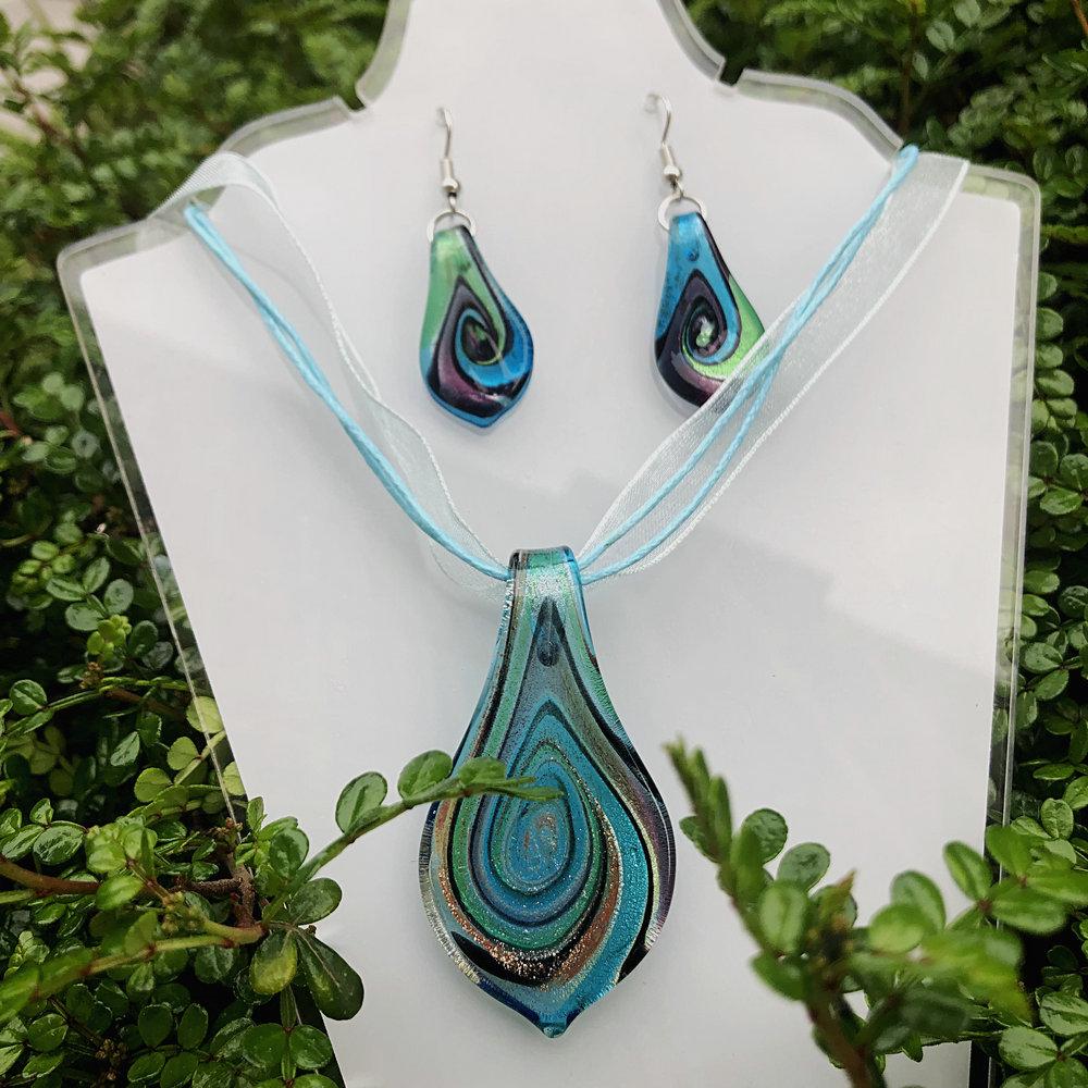 Trendy Blue Glass Ribbon Pendant Necklace & Earring Set - Perfect Seaside Vacation Accessory.