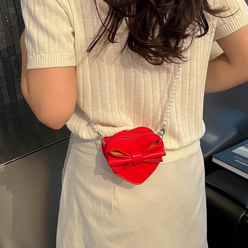 Summer new Korean version heart-shaped bow women's bag small bag foreign style shoulder bag solid color small bag messenger bag women
