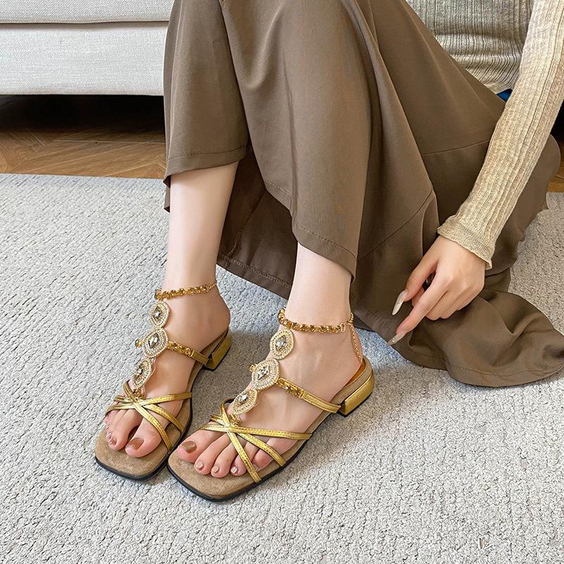 

French shit-stepping open-toed Roman flat-soled sandals women s summer wear 2025 new fairy style thick-heeled women s shoes 42 золотий