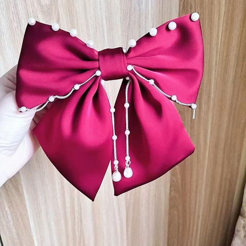 1pc Exquisite pearl hanging large bow hair clip, high-end feeling at the back of the head, spring clip top clip, new headwear