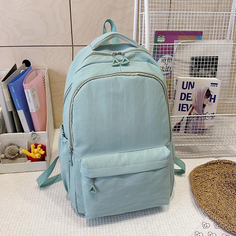 

Fashion backpack New nylon ultra-light leisure bag Large capacity travel bag Junior high school and high school student schoolbag single package синий