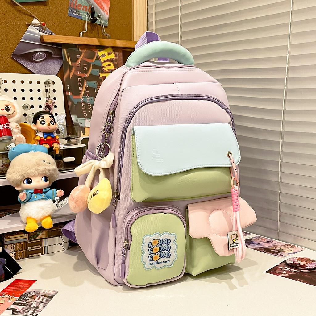 

Nylon School Backpack For Girls With Shoulder Strap And Cartoon Letter Print Design For School And Travel Taro Purple