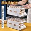 Egg tray for refrigerator, holds 24 eggs, automatic refilling, 2-tier design, sliding lid, convenient storage.