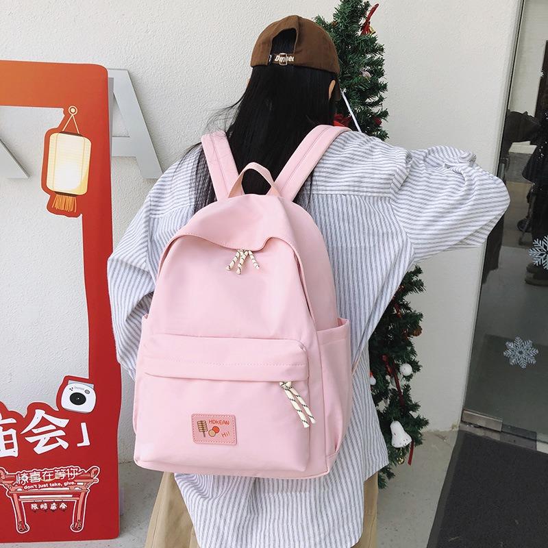 New casual simple solid color backpack large capacity junior high school student schoolbag