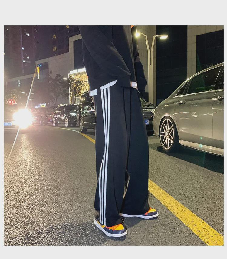 Damskie spodnie sportowe w paski w stylu koreańskim - luźne, sięgające do ziemi, w jednolitym kolorze, na wiosnę i jesień